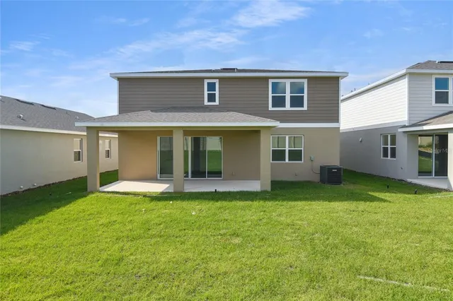 a view of a swimming pool with an outdoor seating