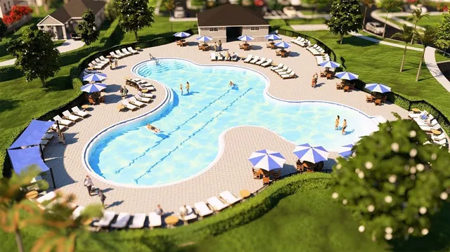 an aerial view of a swimming pool patio and outdoor seating