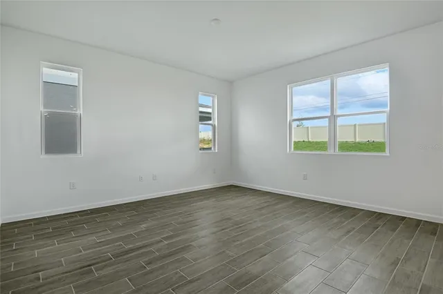 a kitchen with stainless steel appliances a refrigerator and wooden cabinets