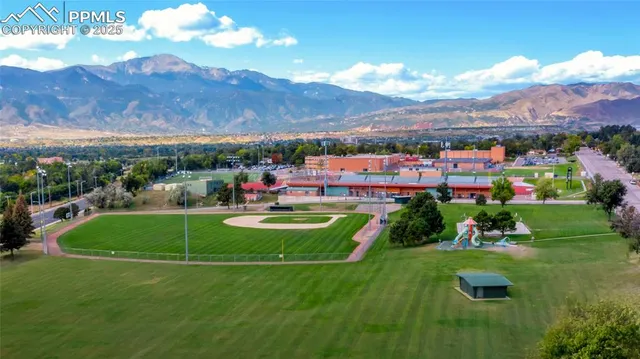 a view of a golf course with a houses