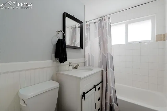 a bathroom with a sink a toilet and a bathtub