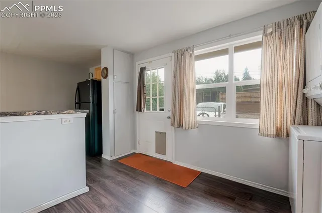 a room with window and wooden floor