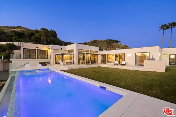 a view of a house with a swimming pool