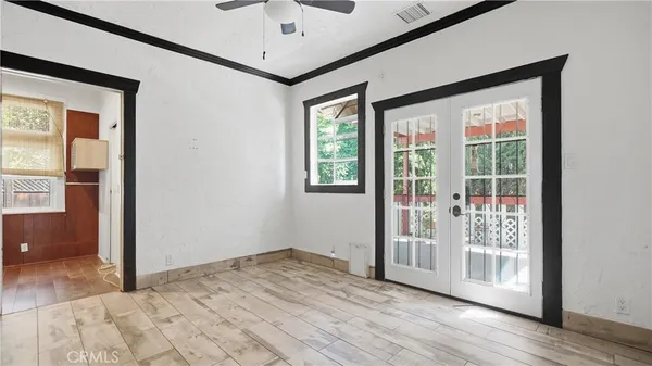 a view of a balcony with wooden floor