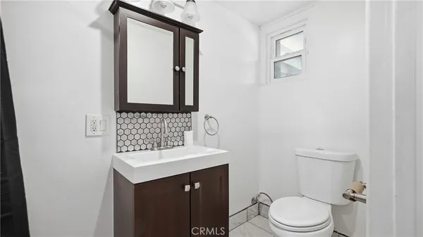 a bathroom with a sink a vanity and a mirror