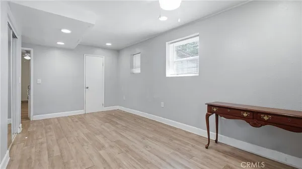 a kitchen with white cabinets appliances and a sink