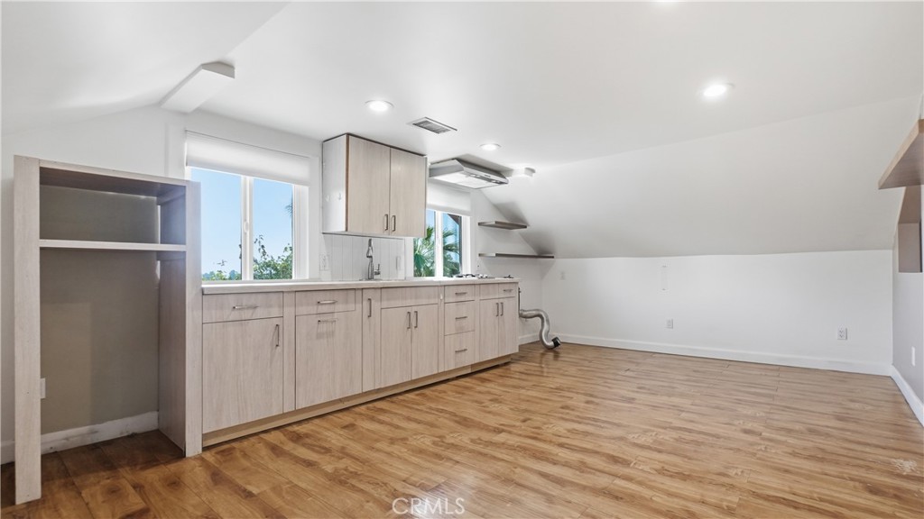 10568 Foothill Boulevard Sylmar, CA 91342 - Photo 27 of 34 a view of a kitchen with wooden floor