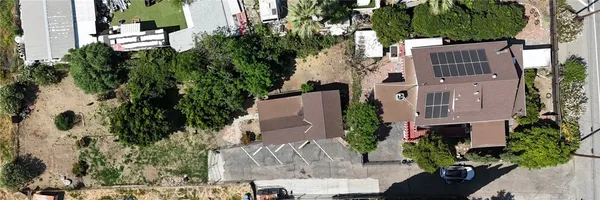 an aerial view of a house with a garden