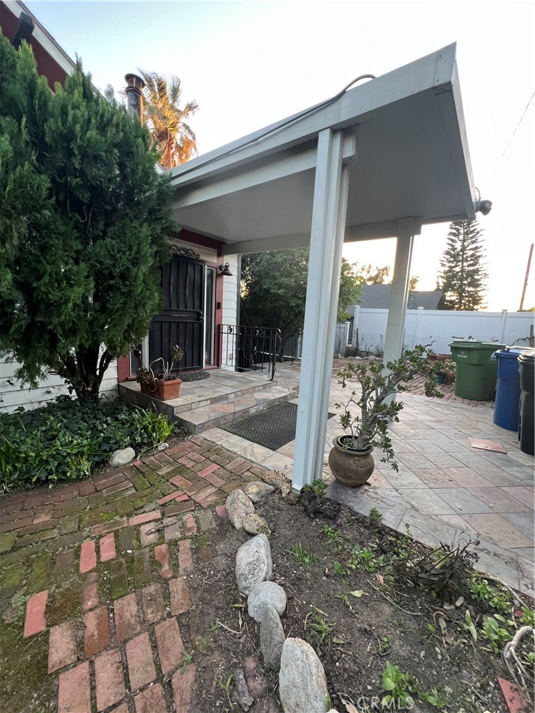 10568 Foothill Boulevard Sylmar, CA 91342 - Photo 32 of 34 a front view of a house with a yard