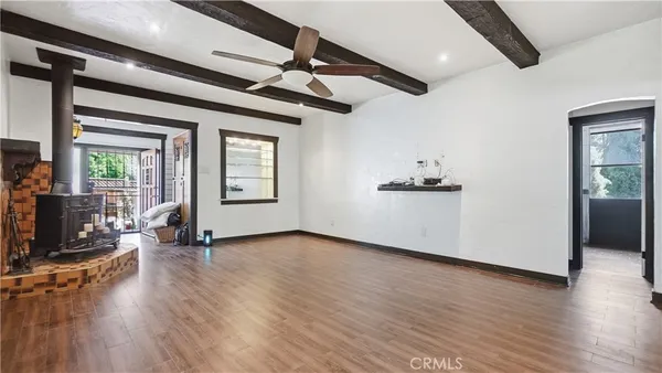 a kitchen with a checkered floor and white cabinets