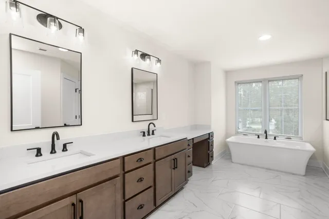 a bathroom with a bathtub and shower