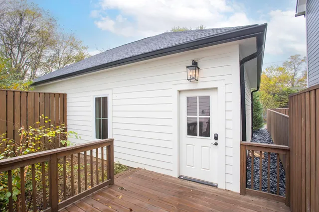 a view of a wooden bench on the roof deck