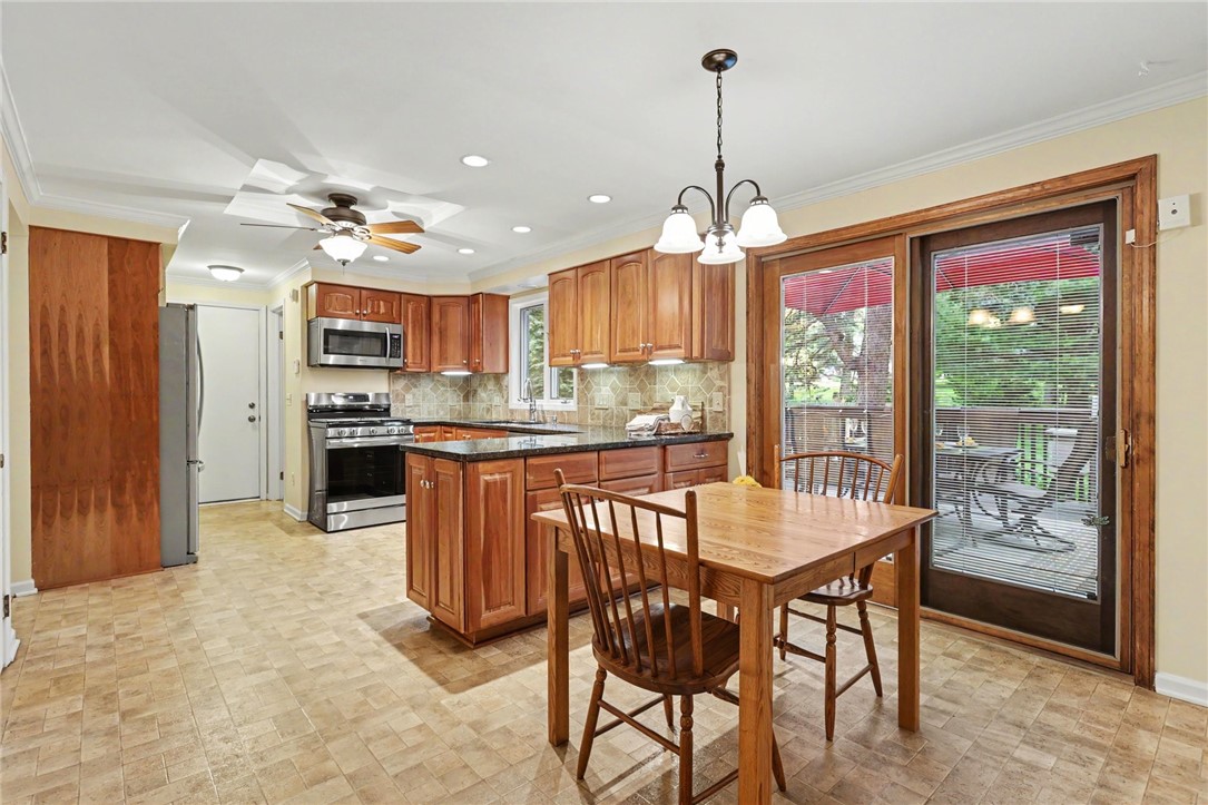 10 High Point Drive Parma, NY 14559 - Photo 8 of 28 Eat-in area in the kitchen has sliding glass door