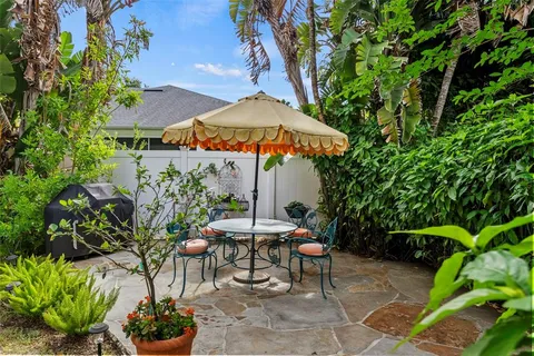 a view of a backyard with sitting area and furniture