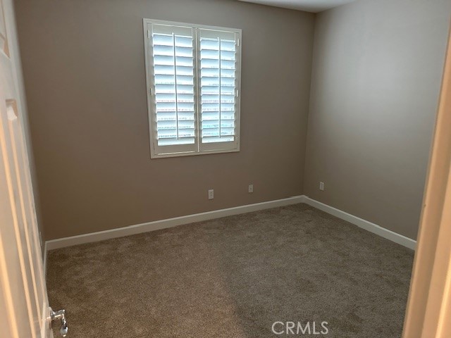 650 Winter Pine Street Beaumont, CA 92223 - Photo 22 of 32 an empty room with a window