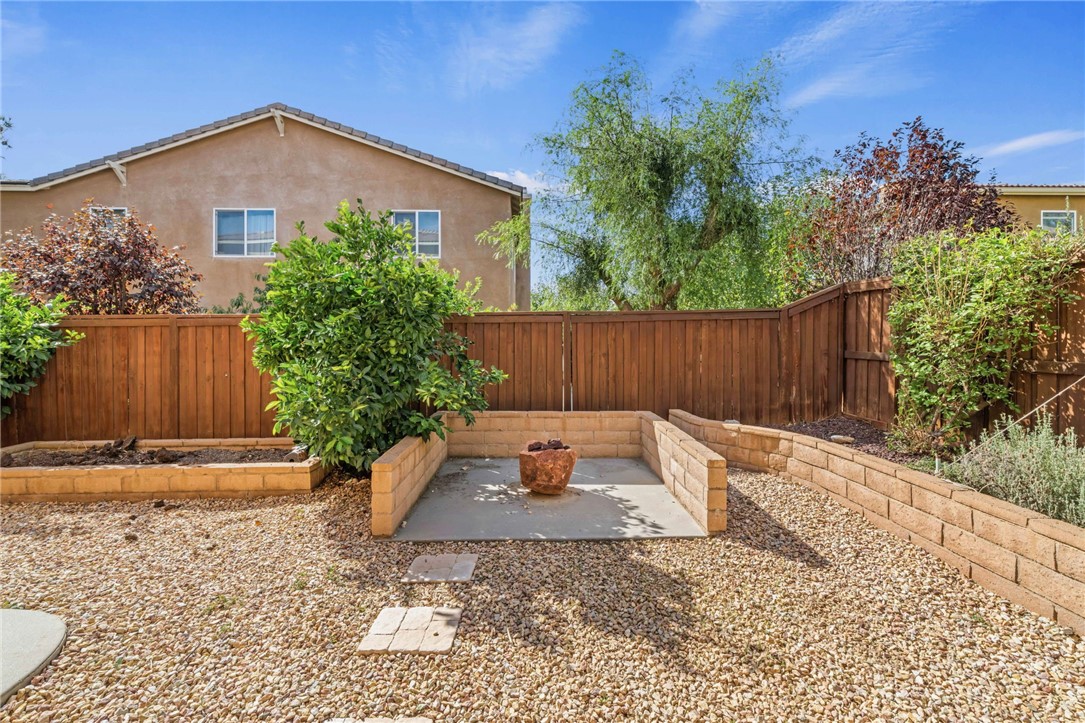 650 Winter Pine Street Beaumont, CA 92223 - Photo 27 of 32 a backyard of a house with plants and tree
