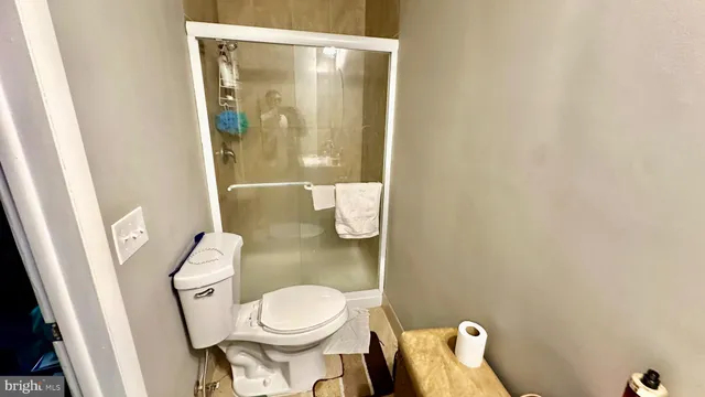 a bathroom with a granite countertop sink vanity mirror and a mirror