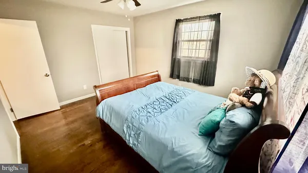 a bedroom with bed and window
