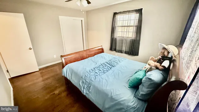 a bedroom with bed and window