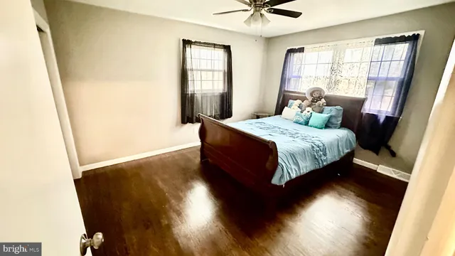 a bedroom with a bed closet and a window