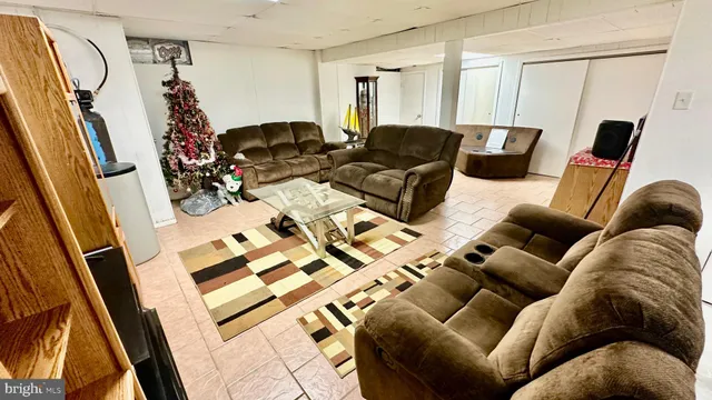 a kitchen with a sink a stove a window and chairs