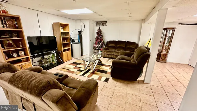 a kitchen with stainless steel appliances granite countertop a refrigerator a stove top oven a sink and dishwasher