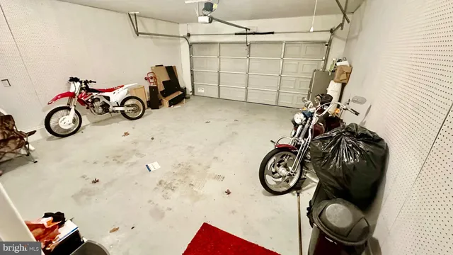 a living room with furniture a dining table and chairs