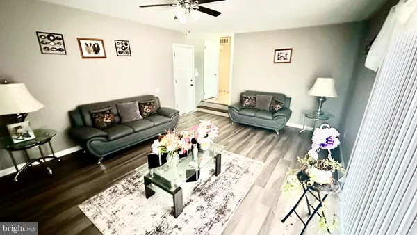a kitchen with stainless steel appliances kitchen island granite countertop furniture a refrigerator a stove a sink and dishwasher