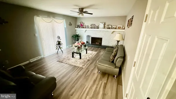 a view of a bedroom with wooden floor and entryway