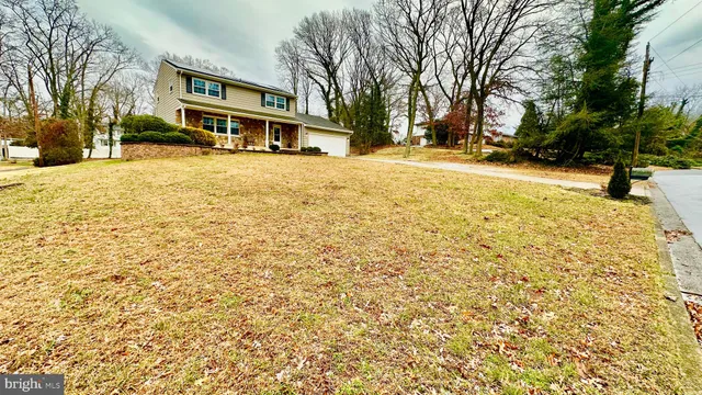a front view of a building with a yard