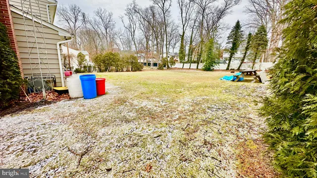 a view of a house with swimming pool and sitting area