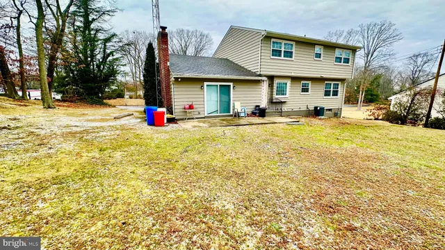 a view of residential house with snow on the road