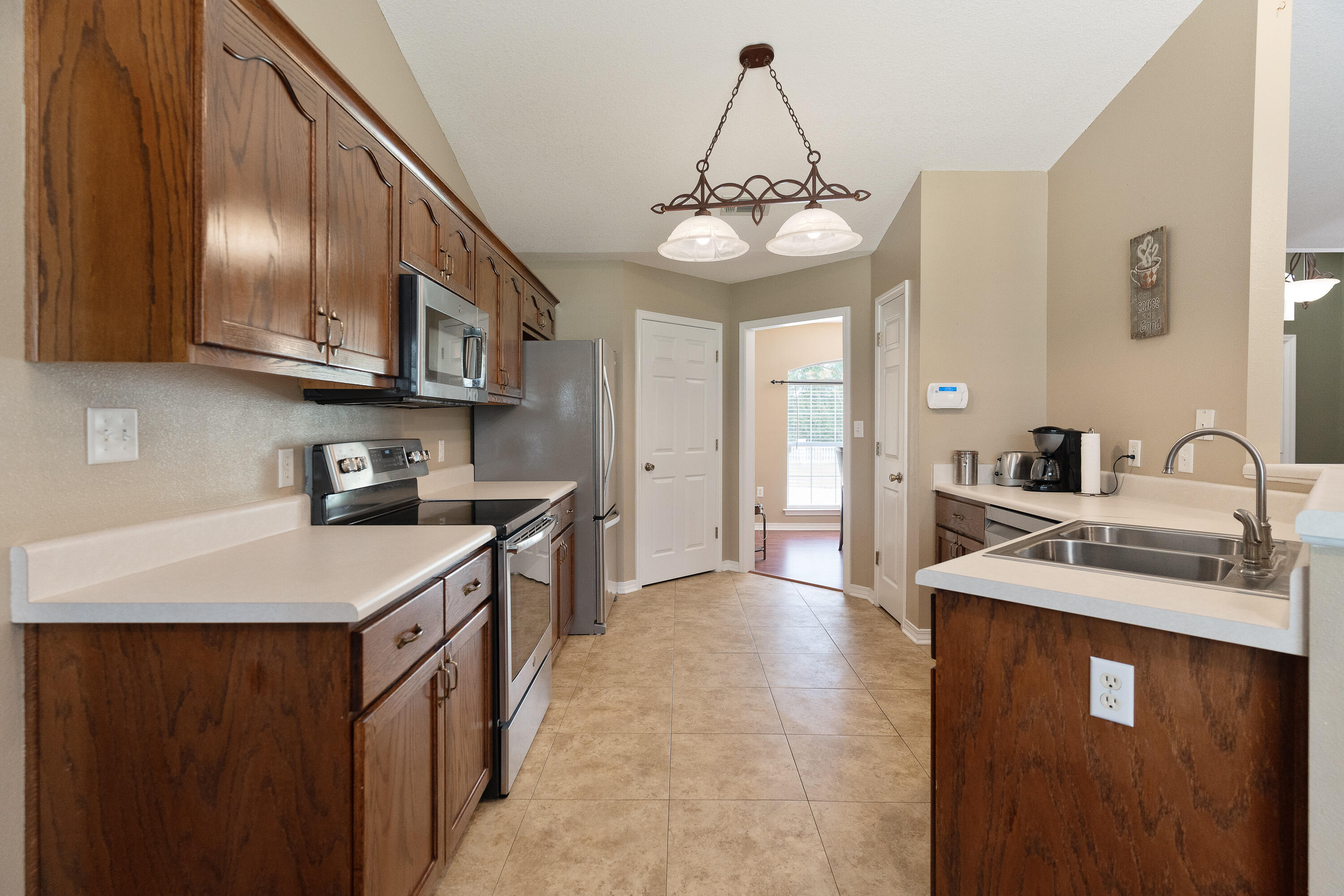 6100 Buckward Road Baker, FL 32531 - Photo 40 of 55 a kitchen with stainless steel appliances granite countertop a sink a stove and cabinets