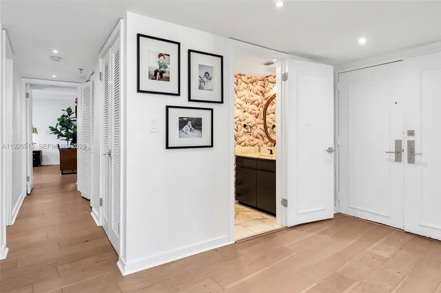 a view of a hallway with paintings on the wall