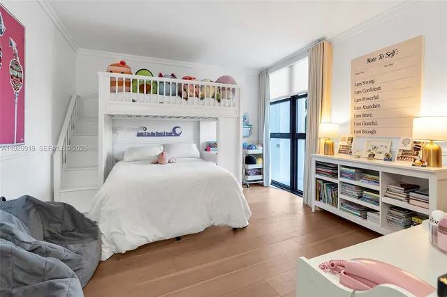 a bedroom with furniture and a book shelf