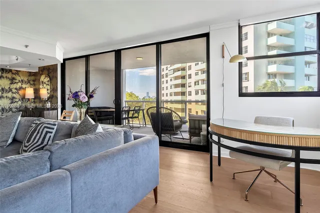 a living room with furniture and a large window