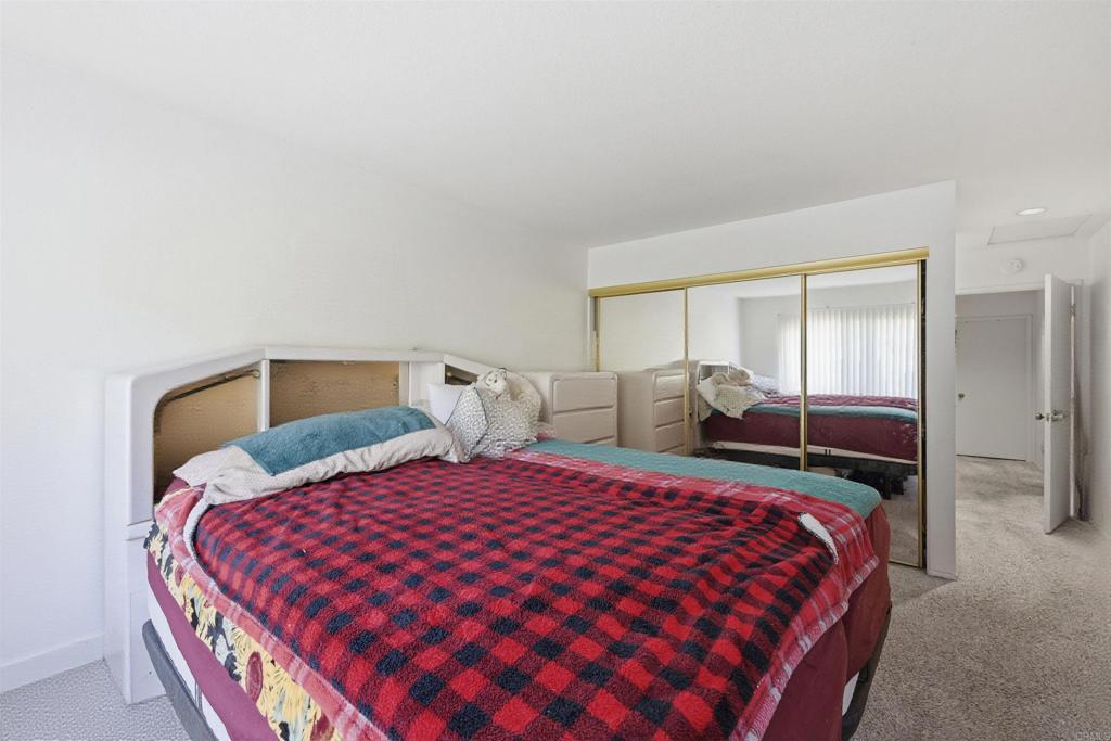 4308 Los Padres Drive Fallbrook, CA 92028 - Photo 9 of 21 a bedroom with double bed and a large mirror