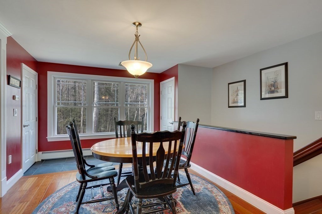 233 Ashburnham State Road Westminster, MA 01473 - Photo 20 of 42 a view of a dining room with furniture wooden floor and chandelier