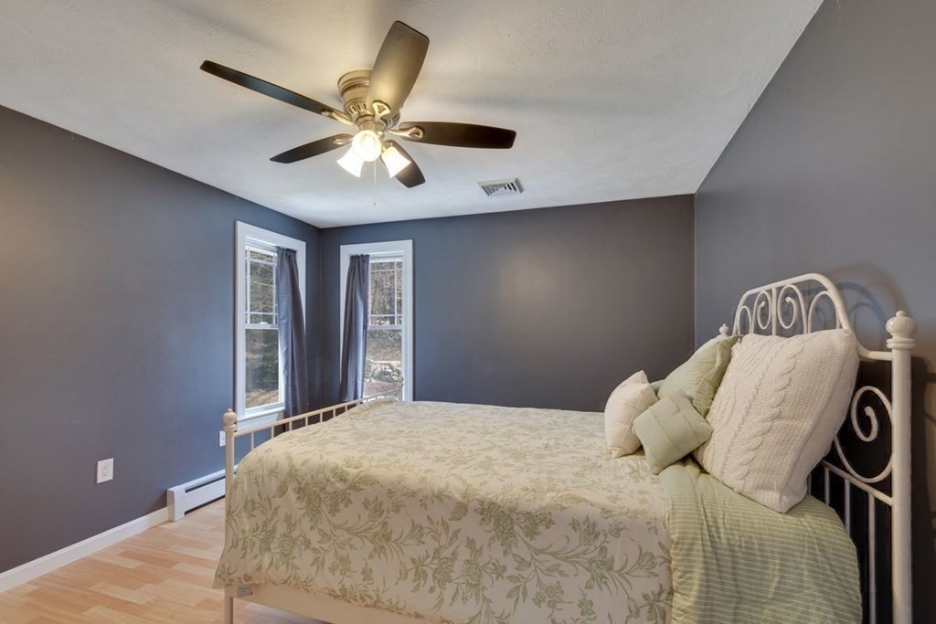 233 Ashburnham State Road Westminster, MA 01473 - Photo 25 of 42 a bedroom with a bed and a ceiling fan