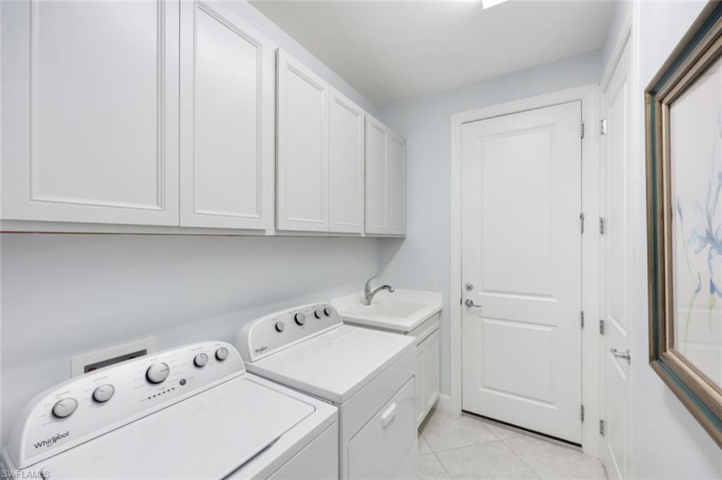 10763 Manatee Key Lane Estero, FL 33928 - Photo 16 of 33 a view of storage and utility room with washer and dryer