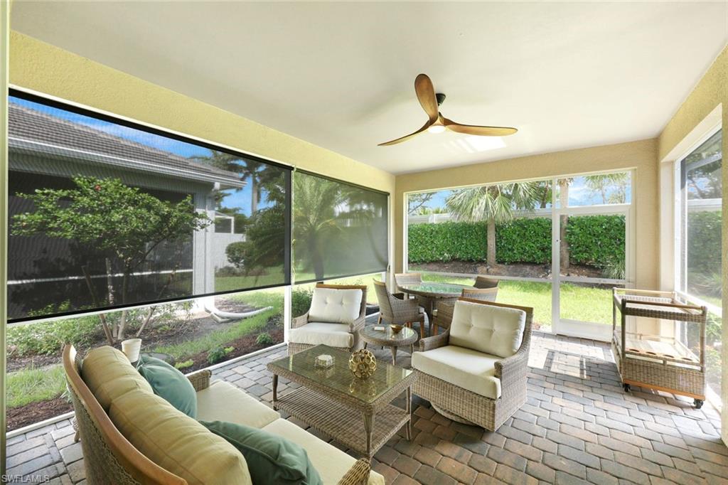 10763 Manatee Key Lane Estero, FL 33928 - Photo 17 of 33 a living room with furniture and a large window