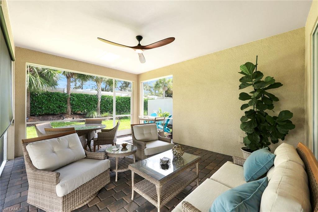 10763 Manatee Key Lane Estero, FL 33928 - Photo 18 of 33 a living room with furniture and a large window