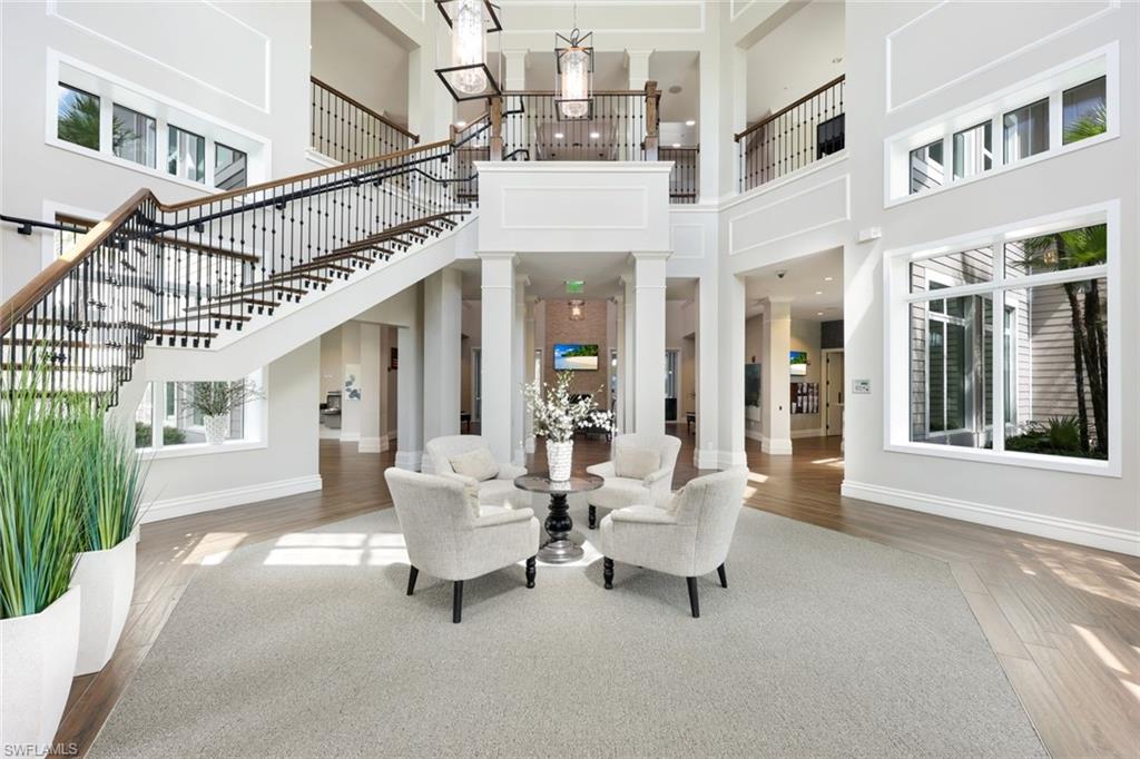 10763 Manatee Key Lane Estero, FL 33928 - Photo 22 of 33 a living room with furniture and a large window