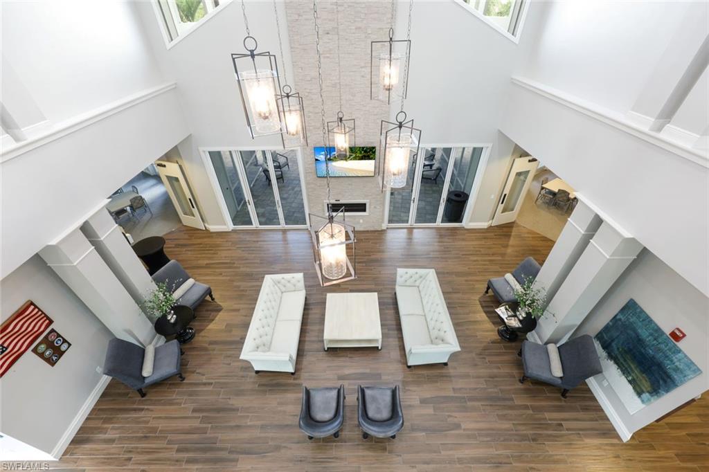 10763 Manatee Key Lane Estero, FL 33928 - Photo 23 of 33 a view of living room with furniture and wooden floor