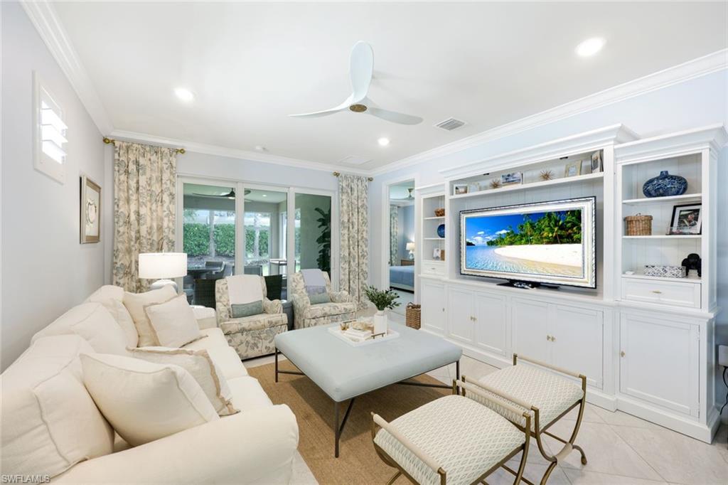 10763 Manatee Key Lane Estero, FL 33928 - Photo 3 of 33 a living room with furniture and a flat screen tv