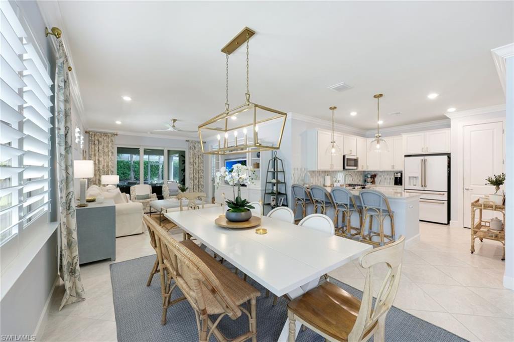 10763 Manatee Key Lane Estero, FL 33928 - Photo 9 of 33 a view of a dining room with furniture