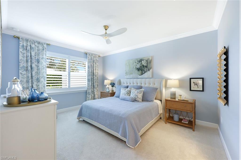 10763 Manatee Key Lane Estero, FL 33928 - Photo 10 of 33 a bedroom with a bed and a couch