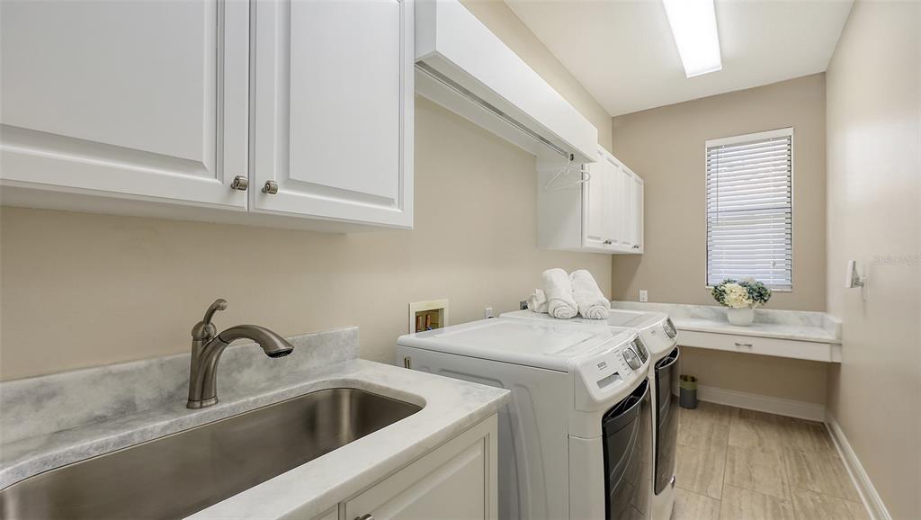 6919 Dominion Lane Lakewood Ranch, FL 34202 - Photo 55 of 99 a view of a sink a washer and dryer