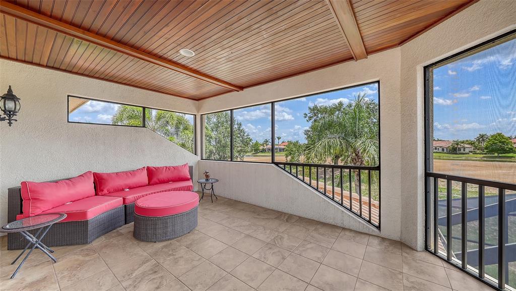 6919 Dominion Lane Lakewood Ranch, FL 34202 - Photo 67 of 99 a outdoor space with the couches and pool table