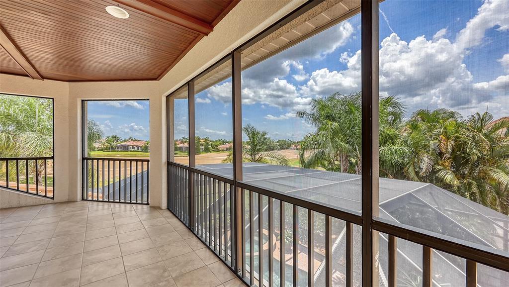 6919 Dominion Lane Lakewood Ranch, FL 34202 - Photo 68 of 99 a view of a porch with a large tree